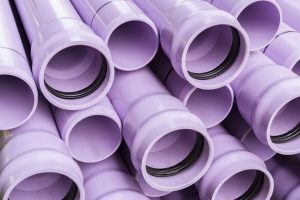 Stack of purple pipes used for reclaimed water lines