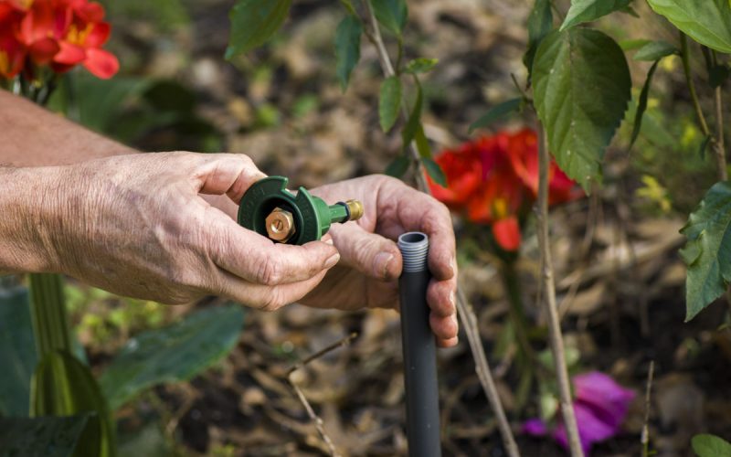 Putting an irrigation spray head on a pipe