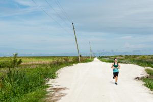 Person running on trail at Lake Apopka North Shore