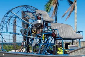 Airboat sitting along a water body