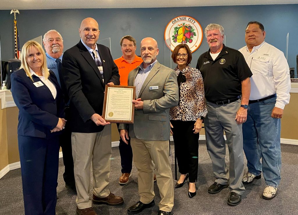 orange-cityu Jim Cannon accepting a proclamation