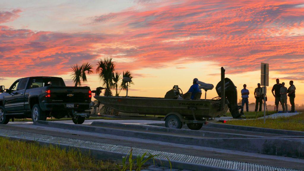 A fishing boat being launched in the early morning